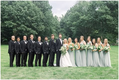 Black And Sage Tuxedo, Groom In Sage Green, What Color Suit Goes With Sage Green Dress, Sage Green And Black Bridal Party, Sage Green And Black Tux Wedding, Sage Green And Black Groomsmen Attire, Groomsmen With Sage Green Bridesmaids, Sage Green Bridesmaid Dresses And Tan Suits, Black Tux Sage Green Tie