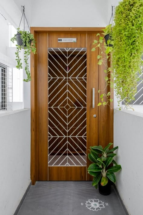 Tapas – Residential Interior | Studio 32 | Pune – Interiorlover Projects Safety Door Wooden Design, Wooden Door Colour Ideas, Modern Safety Door Design, Penthouse Door, Net Door Design Wooden Modern, Safety Door Design Entrance, Apartment Front Doors, Security Door Design, Safety Doors