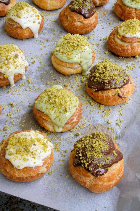 Easy Pistachio Cream Puffs with Chocolate Glaze - Cristina's Kitchen Pistachio Cream Puffs, Pistachio Puff Pastry, Persian Cream Puffs, Pistachio Pastry, Puff Pastry Cream Puffs, Pistachio Dessert, Creme Puff, Cream Puff Recipe, Pistachio Cream