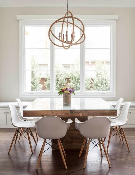 Contemporary dining room features a rope sphere chandelier hanging over a square wood dining table with glass top lined with Eames Molded Plastic Armchairs. Country Kitchen Tables, Dining Table Ideas, Chic Dining Room, Coastal Dining, Dining Room Contemporary, Square Dining Table, Contemporary Dining Room, Square Dining Tables, Square Table