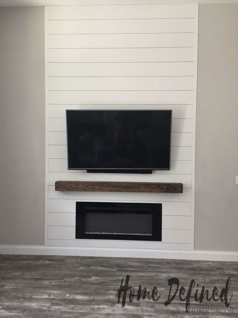 Defining your living room with a farmhouse DIY shiplap accent wall does not have to be costly or difficult. Learn how to make your own faux shiplap from plywood and create an easy and affordable statement wall for any room in your home.    When we first closed on our house, I knew that even though it was newly built, many upgrades needed to be done in order to make it feel like home. We decided that the first room we needed to define was our living room w… Shiplap Fireplace Flush With Wall, Shiplap Tv Accent Wall Without Fireplace, Shiplap Wall Mantle, Mounted Tv On Shiplap Wall, Interior Siding Ideas, Shiplap Faux Fireplace Wall, Flat Wall Fireplace Ideas Shiplap, Flat Shiplap Fireplace Wall, Fireplace Tv Wall Modern Interior Design Shiplap