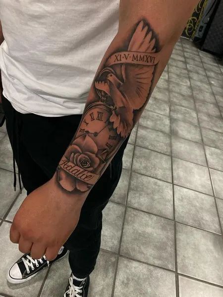 Forearm Dove Tattoo Rip Arm Tattoo Men, Men Dove Tattoo, Dove Sleeve Tattoo For Men, Rip Grandma Tattoo For Men Forearm, Rip Tattoos For Women Forearm, Rose And Dove Tattoo For Men, Angle Tattoo For Men Forearm, Make Forearm Tattoo, Dove Tattoo Men Sleeve