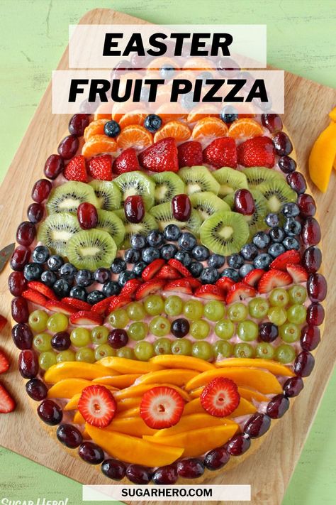 This Easter Fruit Pizza is the perfect Easter recipe! Serve this beautiful fruit pizza for breakfast, brunch, or even as a light Easter dessert. It has an Easter Egg sugar cookie crust, a generous layer of strawberry frosting, and lots of fresh fruit. #sugarhero #easterdessert #fruitpizza #easterfruitpizza Fruit Pizza Easy, Egg Fruit Pizza, Sugar Cookie Easter, Easter Egg Fruit Pizza, Easter Tart, Spring Dessert Ideas, Fruit Pizza Sugar Cookie Recipe, Egg Fruit, Fruit Sugar Cookies