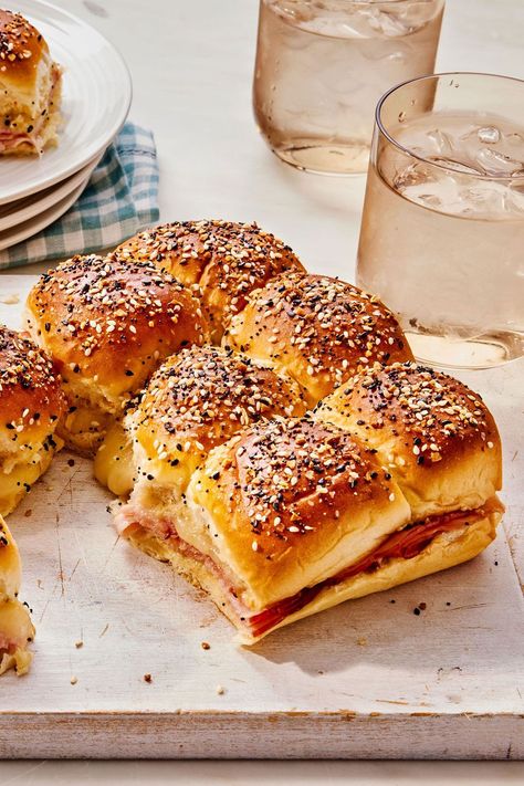 Classic Ham Delights are the most-searched appetizer in the South, and for good reason. These mini and melty ham sandwiches are super satisfying and easy to eat, which is what everyone wants in an appetizer. Plus, they're a host’s dream—they aren’t fussy to make but look impressive. #hamandcheesesliders #minihamandcheese #minisandwiches #appetizers #classicrecipes Ham Snacks Appetizers, Ham Finger Sandwiches, Ham Party Sandwiches, Leftover Ham Appetizers, Snack Sandwiches Appetizers, Cold Party Sandwiches, Small Sandwiches For Party Appetizers, Ham Appetizers Finger Foods, Appetizer Sandwiches Mini