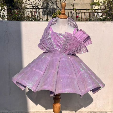 "Introducing our stunning purple structured dress, crafted from sequined fabric. This beautiful dress is ideal for birthday outfits, making every celebration special. Perfect as a kid's dress, it adds a touch of elegance to any child wear collection." #celebrity #kid #dress #DesignerWear #devydesigns #devy #luxuryfashion #likeforlikes #explorepage #TrendyKids #treandingreels #Glam #grow #viralreels #photooftheday #Fashionista #MomDaughterTwinning Birthday Outfit For Baby Girl, Kids Birthday Dresses, Birthday Frocks, Kid Dress, Sequined Fabric, Children Dress, Sewing Clothes Women, Structured Dress