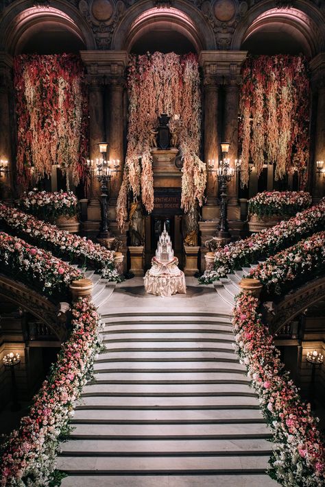 We are beyond thrilled to share the magic of this grand venue, where opulence meets elegance at every turn. From the majestic staircase adorned with breathtaking florals to the stunning cake that mirrored the ballroom perfectly, every detail was crafted to WOW! This iconic setting is perfect for a dream wedding or luxurious celebration. luxury event design, Paris wedding venue, majestic staircase, elegant floral decor, wedding cake inspiration, opulent wedding ideas. Extravagant Wedding Ideas, Dramatic Wedding Entrance, Fairytale Castle Wedding, Royal Inspired Wedding, Vintage Wedding Venue Aesthetic, Magical Wedding Theme Fairytale, Regal Wedding Theme, Castle Wedding Aesthetic, Royal Fairytale Wedding