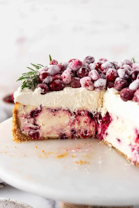 This Cranberry Cheesecake is a showstopping dessert guaranteed to get wild praise and requests for you to be in charge of dessert every year. It's got a few components, but it's well worth the effort when you present this stunning Christmas cheesecake piled high with sugared cranberries and hear the oohs and ahhs from your friends & loved ones. #cranberries #cranberry #Christmas #cranberrycheesecake #cheesecake Cranberry White Chocolate Cheesecake, Cheesecake With White Chocolate, Cranberry Cheesecake Recipes, Lush Desserts, Desserts Fancy, Cranberry White Chocolate, White Chocolate Raspberry Cheesecake, Cranberry Dessert, Cranberry Christmas