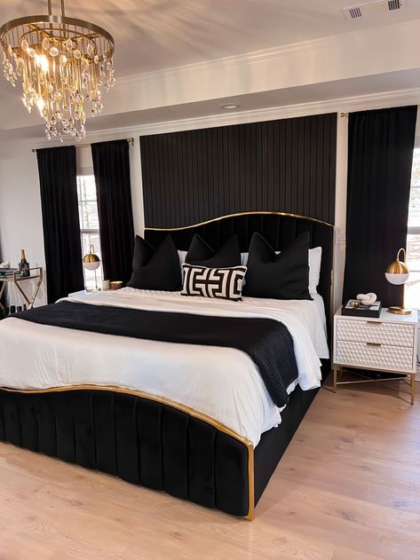 black & gold bed frame, unique asymmetrical bed frame, black throw pillows, black curtains, white bedding, modern bedroom style Black Gold Bed Frame, Room Decor With Black Bed Frame, Black Bedroom Decor Beds & Frames, Gold And Black Bedroom Decor Ideas, Black And Gold Aesthetic Bedroom, Black And Gold Bed Frame, Black And White Gold Bedroom Ideas, Black Bed Frame With White Furniture, Black Bed With White Furniture