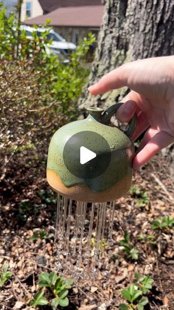 Cheri Downey | Ceramicist on Instagram: "🪴Plant Watering Bell: How-To🪴 

I didn’t have an indoor potted plant near me to show you how these work so I did it outside 😂 BUT I feel like this is still a great example!! When you cover the top hole with your thumb, it blocks airflow and therefore blocks water from falling out. So with these, you can move plant to plant for watering time and release your thumb over each plant! I love the flow and how it looks like a rain shower 💧 

Anyways, if you want one, I have sent them all over to @glasstangerine for purchase 🤍

#ceramics #pottery #potteryasmr #glaze #ceramicglaze #glazelayering #supportsmallbusiness #giftideas #homedecor #wateringbell #handmademug #madeinaskutt #fired #wheelthrown  #brownclay #speckledclay #cookeville #cookevilleplants Thumb Watering Can, Thumb Watering Pot, Pottery Watering Bell, Ceramic Watering Bell, Watering Bell, Ceramic Watering Can, Throwing Clay, Water Time, Pottery Projects