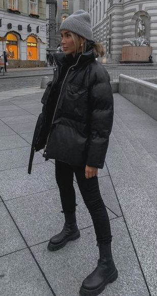 Winter Outfits 2023 Puffer, Bulky Sneakers Outfit, 2024 Winter Jacket Trends, Tall Chelsea Boots Outfit Women, Queenstown Winter Outfit, Black Puffer Outfits For Women, Winter Casual Outfit For Women Street Style, Puffer Coat Outfit Black Women, Cold Weather Sports Mom Outfits