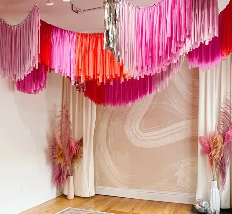 Fringe Banner Ceiling, Ceiling Fringe Garland, Fringe Ceiling Decor, Fringe Garland Diy, Diy Fringe Garland, Streamer Ceiling, Pink Backdrop Ideas, Ceiling Garland, Fringe Ceiling