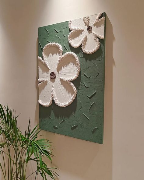 Each piece in the series is crafted on a cotton and linen canvas using acrylic paints to create textured, three-dimensional floral designs that pop against their backgrounds. 🔍 Product: Milly Flowers 3D Wall Art 👆 Tap the link in bio for more wall art pieces! . . . . . . . . . . . . . . . . . . #decorcrushing #interior4u #interior4inspo #sassyhomestyle #inspireushomedecor #housedecoration #mywestwingstyle #moderninteriordesign #dailydecordose #chicinteriors #homedesigns #lightingdesign #drea... Wall Paint Designs Creative Art Ideas, Clay On Canvas Art, Canvas Painting For Wall Decor, Canvas On Wall, Texture Art On Canvas, Textured Art Canvas, Wall Painting Canvas, Homemade Wall Art, 3d Canvas Art