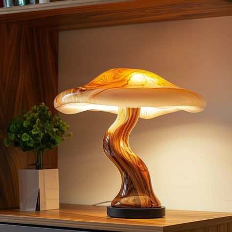 Introducing the “Fungi Glow Lamp,” inspired by the intricate beauty of mushrooms. Its eco-friendly design features a base resembling a mushroom stem and a translucent lampshade mirroring delicate mushroom caps, emitting a soft, enchanting glow. Each lamp is handcrafted, adding a touch of organic charm to any space. Conceptual AI Art Follow @ecosapiens for more! Green Mushroom Lamp, Mushroom Interior Design, Mushroom Lamp Shade, Mushroom Furniture, Mushroom Lampshade, Mushroom Stem, Bioluminescent Mushrooms, Cozy Lamp, Clay Lamps