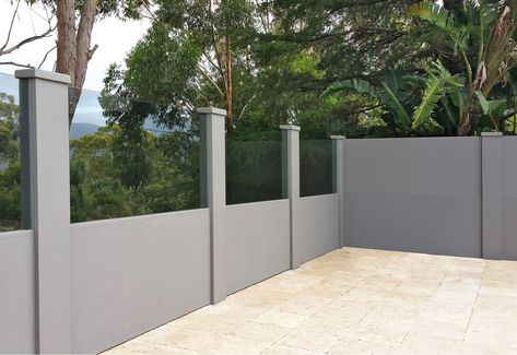 Boundary wall with custom glass infills Glass Fence Garden, Compound Wall Design Ideas, Boundary Wall Designs, Concrete Fence Wall, Glass Fencing, Beach Exterior, Vogue Wall, Door Fence, Noise Barrier