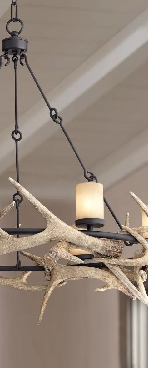 Enhance a farmhouse or lodge-cabin setting with this stylized rustic antler chandelier. This handsome design comes in a round black finish frame, with faux deer horn accents woven around like a jagged crown. #rusticlighting #rusticchandeliers #farmhouselighting #farmhousechandeliers #antlerlighting #antlerchandelier #decoratingideas #rustic #farmhouse #chandeliers #loghomes #logcabins Rustic Ranch Decor, Mountain House Decor, Antler Lights, Farmhouse Chandeliers, Rustic Home Interiors, Antler Chandelier, Loft Lighting, Large Chandelier, Deer Horn