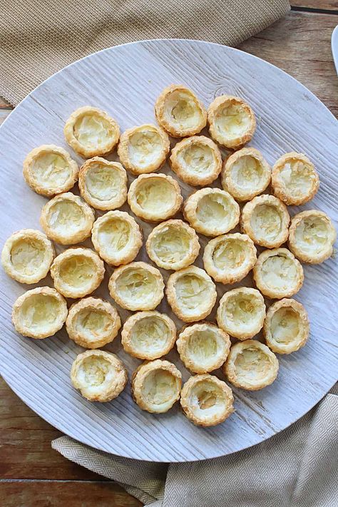 Ever wonder how to make your own fillable Puff Pastry Appetizer Cups? Wonder no more! Once made, you can fill them however you like! They're so versatile! #appetizercups #puffpastryappetizers #appetizers #savoryappetizerpuffs #appetizerpuffpastry #appetizerpuffsforfilling #appetizerpuffs #storeboughtpuffpastry #puffpastryrecipes #puffpastry #kudoskitchenrecipes Puff Pastry Cups Appetizers, Mini Puff Pastry Appetizers, Mini Puff Pastry Desserts, Stuffing Cups, Ham And Cheese Puff Pastry, Ham Cheese Puff Pastry, Puff Pastry Cups, Puff Pastry Appetizer, Pastry Cups