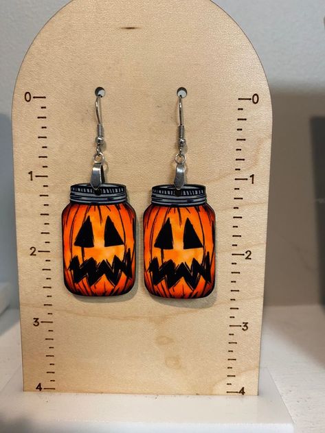 Get ready for fall with our faux leather pumpkin earrings. Ideal for adding a fun and festive flair to your Halloween accessories collection! Leather Pumpkin, Thanksgiving Earrings, Shrinky Dink Crafts, Glowforge Ideas, Laser Cut Wood Crafts, Get Ready For Fall, Diy Resin Projects, Shrinky Dink, Laser Projects