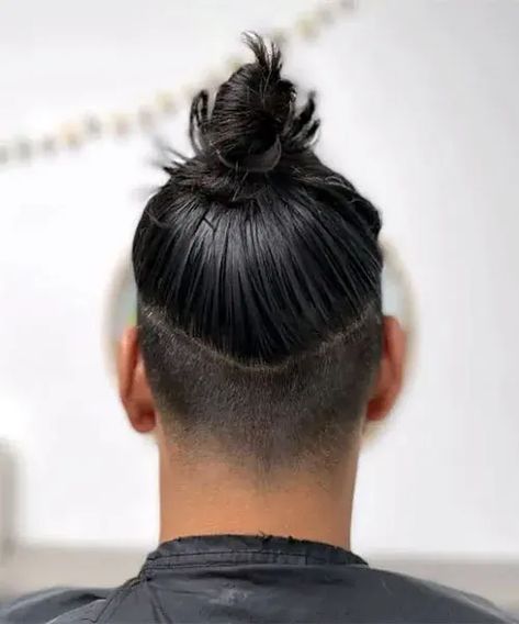 Glossy High Bun with Undercut. This trendy men’s hairstyle can be a cool choice for anyone wanting a fashionable aesthetic with modern edge. Man Bun Undercut Fade, Bun With Undercut, Masculine Hairstyles, Mens Long Hair Undercut, Top Knot Hairstyle, Man Bun Haircut, Top Knot Men, Man Bun Top Knot, Man Bun Undercut