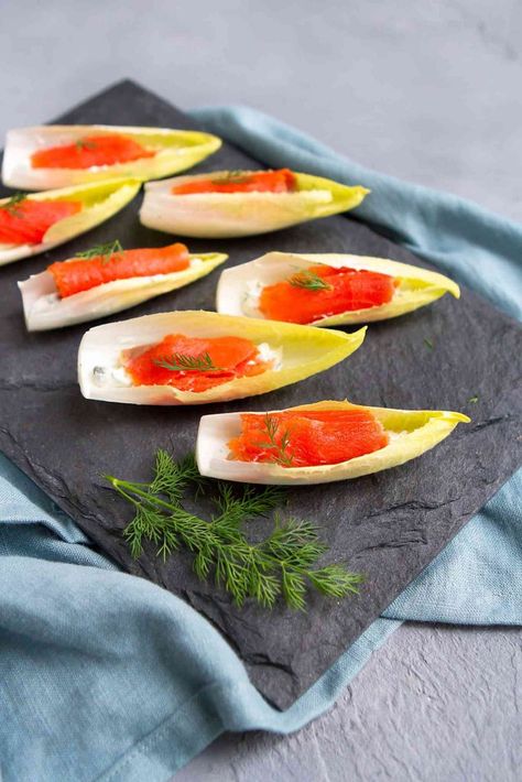 Looking for an easy holiday appetizer? A batch of Smoked Salmon Endive Boats can be made in about 15 minutes. Then watch them disappear from the plate in seconds! 76 calories and 1 Weight Watchers SP | Appetizers | Vegetarian | Healthy | Parties | Finger Food | New Year’s Eve | Stuffed | Hors D’Oeuvres | Simple #appetizerrecipes #smokedsalmon #newyearseve #fingerfood #horsdoeuvres #smartpoints #weightwatchers Salmon Boats Recipe, Salmon Boats, Endive Appetizers, Easy Antipasto, Food To Impress, Antipasto Kabobs, Lchf Snacks, Nye Party Ideas, Salmon Lox