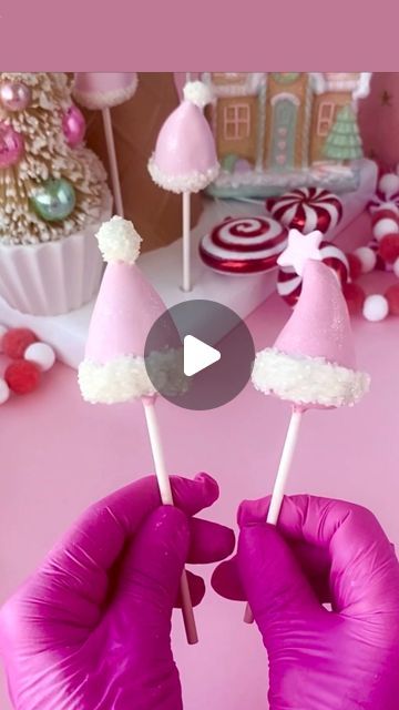 My Little Cakepop Molds 📍Home of the original 3D cake pop mold. on Instagram: "Countdown to Merry PINKMAS🎀🎄⭐️ Get in a festive mood with these adorable pink santa hats💗🎅  Get the look:  Use our cone cake pop mold to shop hat Add a touch of whimsy by bending top of hat slightly before dipping.  Use Sweet Shoppe candy melts with Rose oil color to get the gorgeous pink colour. Tap image for oil color link. Use more color to get a deeper shade of pink.  Shape hat, dip in pink oil.  When dry use piping bad with white candy melts for base of santa hat. Dip in glittered sugar sprinkles (coming soon to MLC).   Attach white or colored Sixlet (round ball candy) to top with a touch of candy melts. When dry dip in candy white candy melts and sprinkle more glittered sugar to get nice big cotton ba Santa Hat Cake Pops, Merry Pinkmas, Pink Santa Hat, Cone Cake, Cake Pop Molds, Hat Cake, Pink Santa, Mini Dessert, Sugar Sprinkles