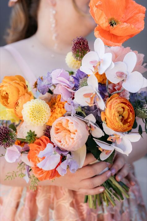 bride holding colorful peach and purple wedding bouquet Peach Purple Wedding, Peach And Purple Wedding, Bridal Bouquet Orange, Grandma Day, Wedding Celestial, Sunset Soiree, Twist Ideas, Purple Flower Arrangements, Orange Bridal Bouquet