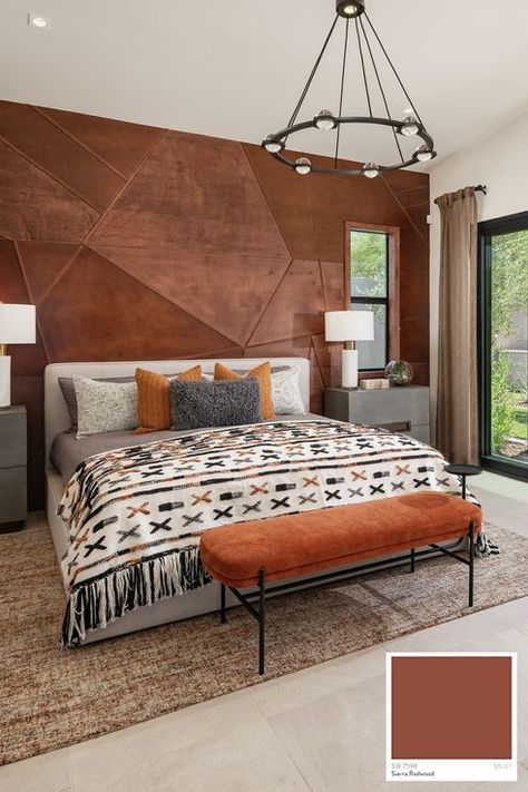 Modern Guest Casita bedroom designed with a unique accent wall and access to a private patio. Accent Wall Interior Paint Color: Sierra Redwood interior paint color by Sherwin-Williams. Southwest Guest Bedroom, Southwest Master Suite, Spanish Accent Wall, Leather Accent Wall, Rust Accent Wall Bedroom, Terra Cotta Accent Wall Bedroom, Rust Color Accent Wall, Modern Organic Accent Wall, Tile Accent Wall Bedroom