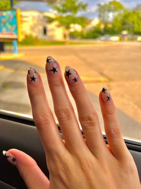 Medium Length Star Nails, White Star Almond Nails, Oval Nails Star Design, Sparkly Nails With Stars, Nails For Christians, Short Aesthetic Almond Nails, Nails With Stars And Gems, Clear Nails With Black Stars, Short Stars Nails