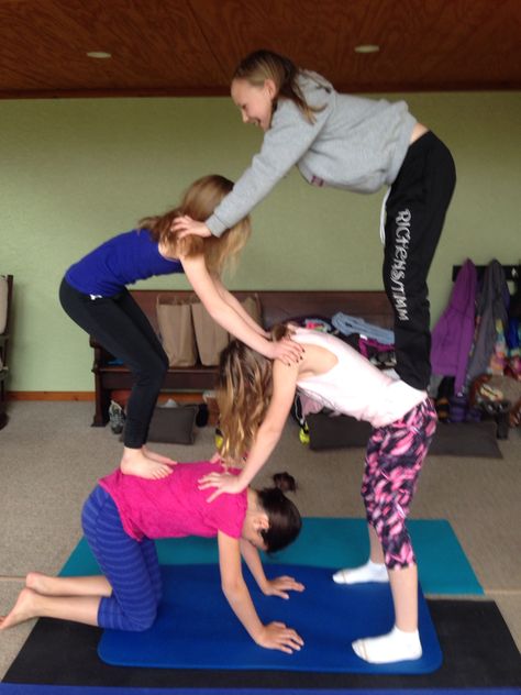 4 person acro yoga Four Person Stunts Easy, 4 Person Acro Stunts, Stunts For 4 People, 4 People Handshake, Yoga 4 People, Triple Yoga Poses, 4 Person Yoga Challenge, 4 Person Acro Poses, 6 People Yoga Poses