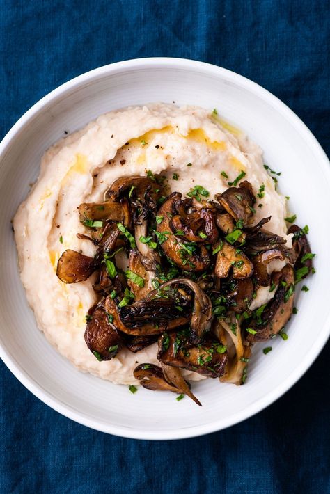 This combo of creamy white beans and garlic sautéed mushrooms is a fancy - albeit ridiculously easy-to-make - vegan main course. Perfect for Thanksgiving, Christmas, and other festive gatherings! thenewbaguette.com #whitebeanpuree #sauteedmushrooms #garlicmushrooms #mushroomrecipe Protein Entrees, White Bean Puree, Creamy White Beans, Bean Puree, Pureed Food, White Bean Recipes, Vegan Main Course, Cooking Dried Beans, Sautéed Mushrooms