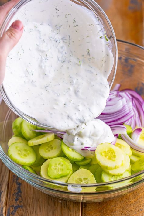 Dressing being poured over salad ingredients. Creamy Cucumber Tomato Salad Sour Cream, Cucumber Salad Mayo, Cucumber Salad Sour Cream, Cucumber Salad With Mayo, Quick Cucumber Salad, Cucumber Salad Creamy, Cucumber And Onion Salad, Cucumber Salad Dressing, Cucumber Salads