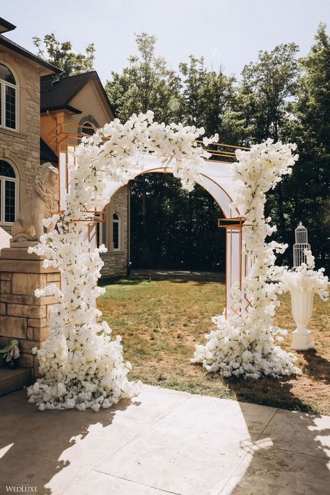 #wedluxe #wedluxemagazine #floral #floralarch #white #gold #reception #wedding #decor Floral Entrance Decor, Wedding Entrance Arch, Entry Wedding, Entrance Arch Design, White Floral Arch, Entry Arch, Wedding Walkway, Wedding Gate, Gold Reception