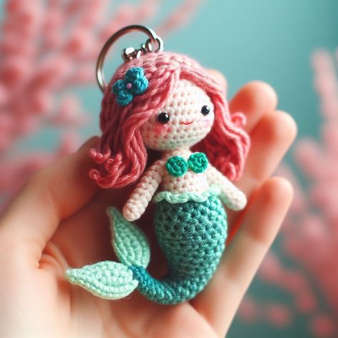 Explore the enchanting detail of this crochet mermaid keychain, featuring a teal tail and rose-pink hair. A perfect blend of charm and craftsmanship. Mermaid Crochet Pattern Free, Crochet Reference, Little Mermaid Crochet, Mermaid Keychain, Mermaid Tail Pattern, Mermaid Crochet Pattern, Crochet Parrot, Crochet Cluster Stitch, Crochet Mermaid Tail