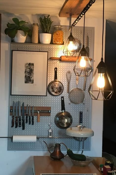 Tired of cluttered countertops? This clever vertical storage solution will transform your small kitchen and home! Check out our blog for more genius vertical storage ideas. Small Kitchen Vertical Storage, Pan Holder Hanging Wall, Peg Board Kitchen, Kitchen Pegboard Ideas, Kitchen Pegboard, Storage Solutions For Small Spaces, Pegboard Kitchen, Kitchen Wall Storage, Organize Your Kitchen