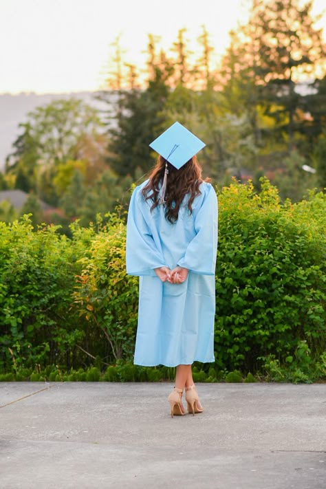 Backside view of high school senior in light blue graduation cap and gown. Gown Graduation, Graduation Pictures For High School, Graduation Photos High School, Grad Pictures High School, High School Graduation Inspo Pics, Cap N Gown Pictures High Schools, College Grad Photo Poses, College Graduation Pictures Poses Photo Shoots Cap And Gown, Graduation Photos Outdoors