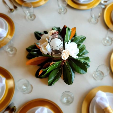 Bold & Belle Designs | These Magnolia centerpieces are just simply gorgeous! 🥰 Created with Fresh Atlanta Magnolia leaves to add a bit of the Southern Beauty to … | Instagram Decorate With Magnolia Leaves, Magnolia Greenery Wedding, Magnolia Leaves Table Runner, Magnolia Wedding Flowers Centerpieces, Magnolia Leaf Table Decor, Magnolia Centerpiece Floral Arrangements, Magnolia Themed Party, Magnolia Wedding Decor, Magnolia Centerpiece Wedding