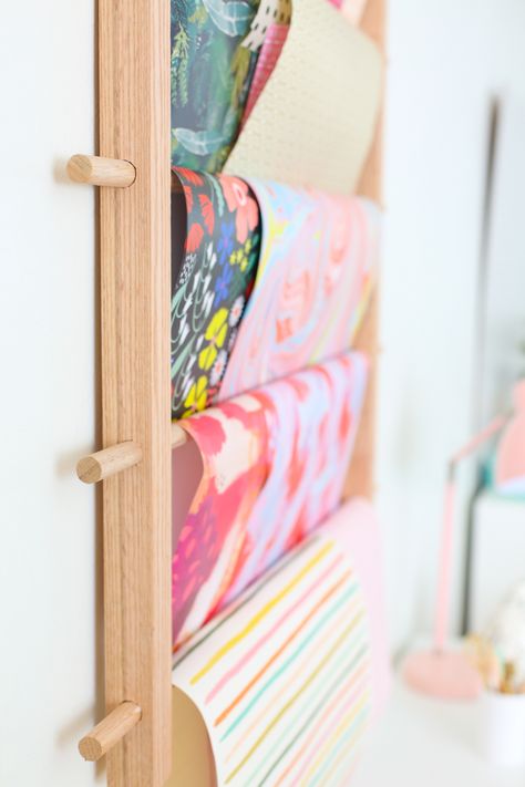 How to Make a Hanging Organizer for All Your Wrapping Paper Art Paper Storage, Wrapping Paper Display, Prize Booth, Diy Dollar Tree Organization, Wrapping Paper Station, Wrapping Paper Holder, Gift Wrap Organization, Wrapping Paper Storage, Crafting Room