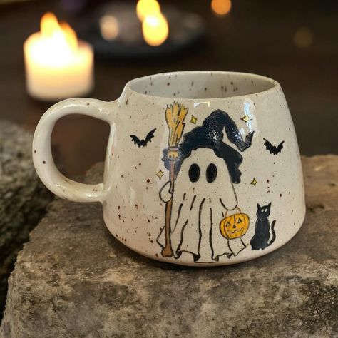 ✨ 🕯️ Witchy Ghost 🕯️ ✨ #pottery #handmade #handmadepottery #londonpotters #ceramics #ceramicart #autumn #autumnvibes #stoneware #wheelthrown #coffee #coffeetime #coffeelover #coffeeshop #mug #coffeemug #tableware #halloween #handmadeceramics #functionalpottery #londonartist #handmadepottery #mugs #functionalceramics #handthrown #handcrafted #handmademug #pottersofinstagram #wheelthrowing Painted Pottery Halloween, Halloween Mug Painting Ideas, Halloween Mug Ideas, Halloween Pottery Painting Ideas, Pottery Painting Halloween, Pottery Painting Autumn, Autumn Pottery Painting, Fall Pottery Painting Ideas, Halloween Pottery Painting