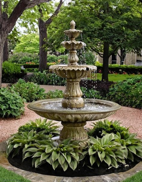 Add a Touch of Elegance with a Fountain Mediterranean Fountain Ideas, Fountain Filled With Flowers, Water Fountain In Front Of House, Formal Ponds Water Features, Savannah Courtyard Gardens, Garden Entertaining Area, Front Yard Fountain Landscaping, Outdoor Fountains Landscape Garden Ideas, Small Garden Fountain Ideas