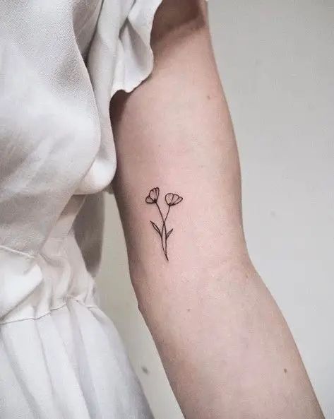 The Best 32 Bicep Tattoo For Women Every Artist Approves - Psycho Tats Women Bicep Tattoo Simple, Inner Bicep Tattoo Women Flower, Under Bicep Tattoo Women, Tattoo Bicep Women, Lower Bicep Tattoo Women, Small Bicep Tattoo, Biceps Tattoo For Women, Small Bicep Tattoos For Women, Women’s Bicep Tattoo