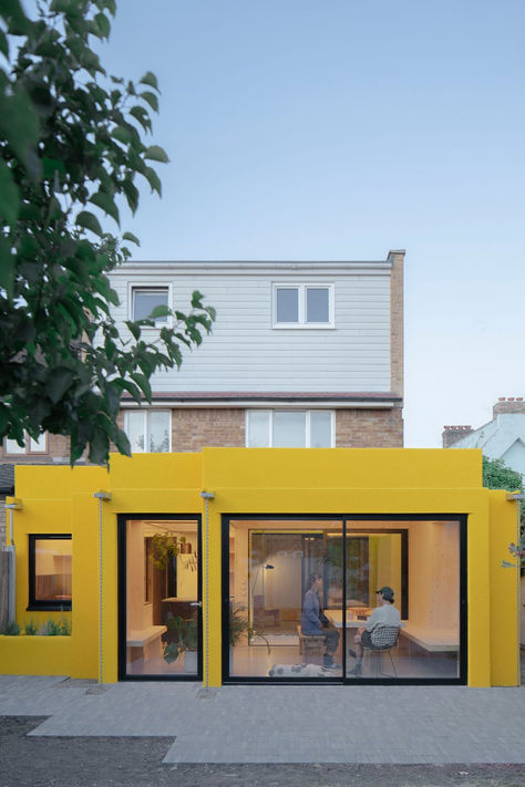 A bright yellow extension on a 1960s style home. Black And Yellow House, Clt House, Modular Apartment, Open Plan Layout, Cross Laminated Timber, Timber Projects, Flat Roof Extension, Terrace Home, Kitchen Extension Ideas