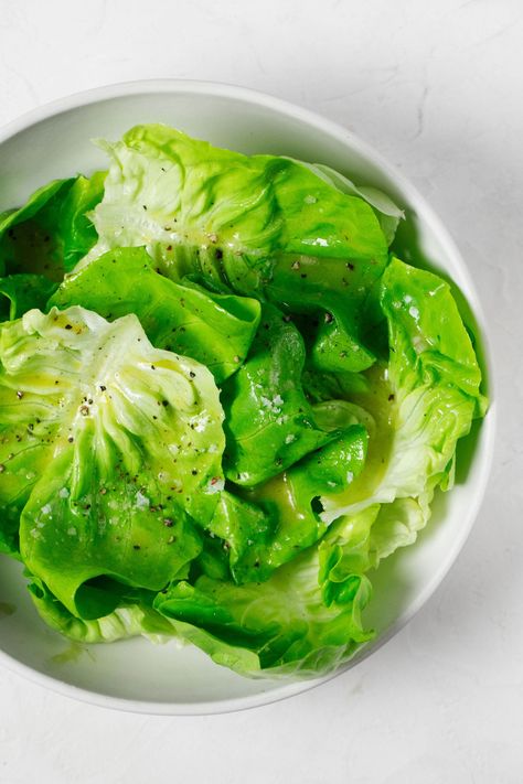 An overhead image of a round white bowl, which has been filled with a fresh green butter lettuce salad. Simple Butter Lettuce Salad, Boston Lettuce Salad, Butterhead Lettuce Recipes, Butter Lettuce Recipes, Salads Green, Writers Studio, Butter Lettuce Salad, Roasting Beets In Oven, Lettuce Recipes