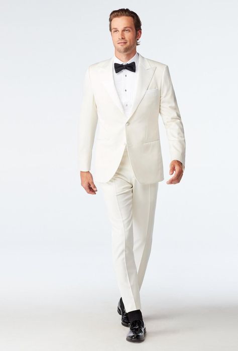 Our Hampton Ivory Tuxedo is luxurious and elegant. Made from the finest Super 140s wool blended with silk and cashmere, this exquisitely tailored suit feels every bit as good as it looks. Satin covered buttons and matching satin lapels elevate the Hampton Ivory Tuxedo even further. Ivory Tuxedo, Tuxedos Wedding, Black Tie Tuxedo, Ivory Suit, White Wedding Suit, Wedding Black Tie, Custom Tuxedo, Cream Suit, Wedding Tux