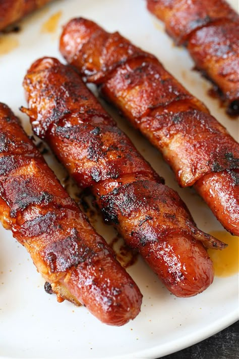 These Bacon Wrapped Hot Dogs are the ultimate hot dog recipe! Super crispy bacon with a snap from the hot dog, coated with a sweet and spicy glaze! Smothered Hot Dogs, Hot Dogs On Griddle, Hotdogs With Bacon, Bacon Wrapped Hot Dogs Grilled, Bacon Wrapped Hot Dogs Air Fryer, Hot Dogs With Bacon, Jumbo Hot Dogs, Hot Dog Wrapped In Bacon, Bacon Hotdogs Recipes