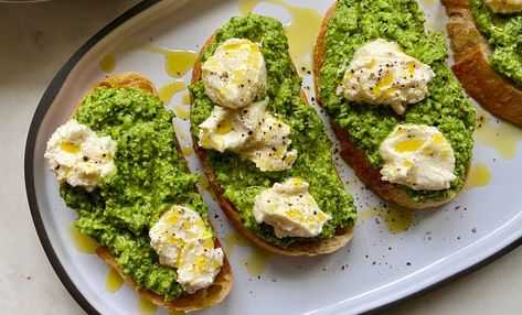 Smashed Pea Toasts with Ricotta Pea Toast, Cooking Cheat Sheet, Smashed Peas, Ricotta Toast, English Peas, Steamed Asparagus, Pita Chips, Pesto Recipe, Lamb Chops