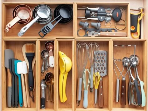 The kitchen is the heart of the home, which means sometimes things can get messy. We have rounded up 30 ideas that will help you keep this space organized. Whether it's a drawer organizer or a custom, built-in pantry, check out our list of hacks to make your kitchen space storage savvy. Kitchen Storage Plates, Kitchen Utinsel Drawer Organization, Kitchen Utensils Drawer, Organized Utensil Drawer, Cooking Utensils Organization Ideas, Cooking Utensil Drawer, Kitchen Spoons Storage Ideas, Storing Kitchen Utensils Organization Ideas, Kitchen Gadget Drawer Organization