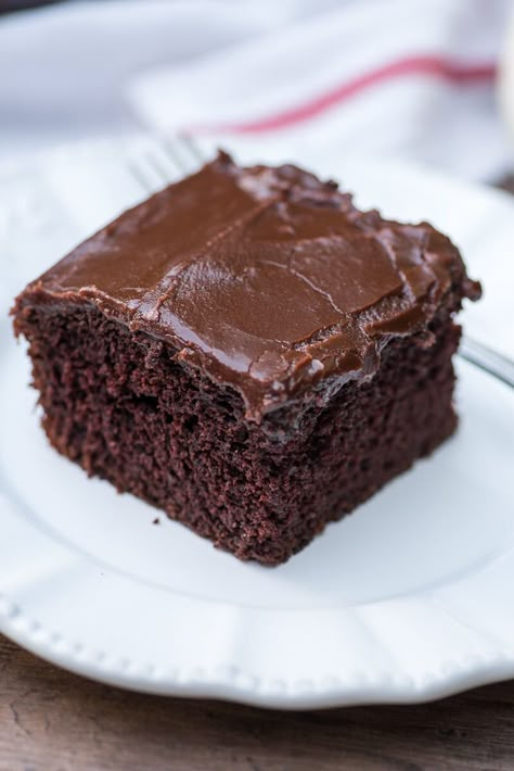 Nearly as easy to make as a boxed mix! This tried and true recipe is perfect for satisfying those intense chocolate cravings. ~ http://www.fromvalerieskitchen.com Texas Sheet Cakes, One Bowl Chocolate Cake Recipe, Vanilla Sheet Cake, Cake Without Eggs, Hillbilly Kitchen, Chocolate Zucchini Cake Recipe, Zucchini Cakes Recipe, Texas Sheet Cake Recipe, Wacky Cake