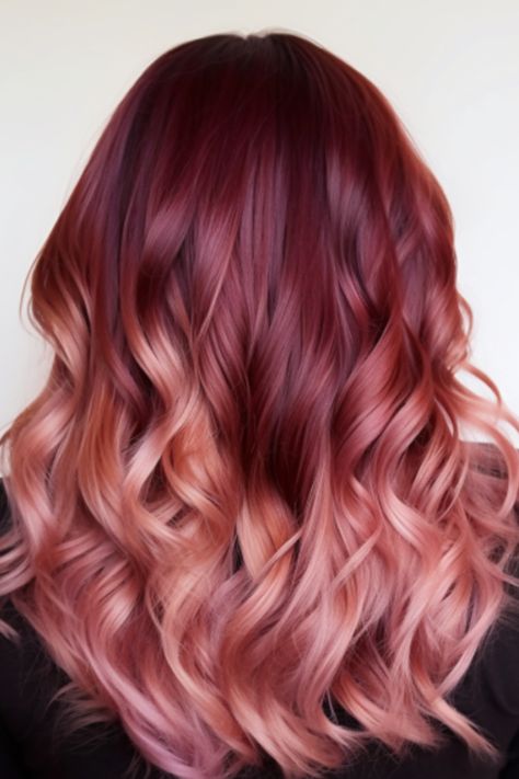 Transitioning from burgundy to a softer rose gold, this ombre look is a captivating bright burgundy balayage option. It’s best for those with mid-length hair and works well with a middle part. Click here to check out more stunning burgundy balayage hair ideas trending right now. Burgundy To Rose Gold Ombre Hair, Burgundy To Pink Ombre Hair, Maroon Blonde Balayage, Burgundy And Rose Gold Hair, Copper Red Hair Color Balayage Rose Gold, Pink Red Balayage, Red To Pink Balayage, Fall Rose Gold Hair, Auburn Hair Pink Highlights