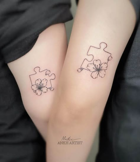 71 Hearty Mother Daughter Tattoos With Meaning Tattoo Ideas Puzzle Pieces, Daughter Mother Matching Tattoos, Matching Ankle Tattoos Mother Daughters, Mother Sister Tattoo, Puzzle Piece Tattoo With Flowers, Tattoo For Mother And 2 Daughters, Mother Daughter Puzzle Piece Tattoo, Special Ed Tattoo, Tattoos For Daughters Meaningful