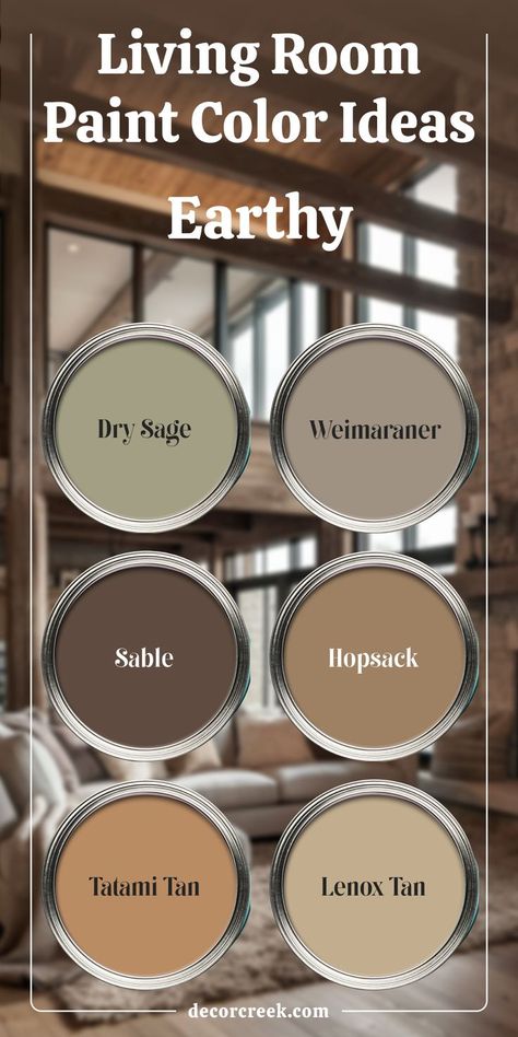 The image presents earthy living room paint color ideas with six paint swatches. The colors featured are Dry Sage, Weimaraner, Sable, Hopsack, Tatami Tan, and Lenox Tan. The background shows a cozy living room with a warm, rustic design, complementing the natural, earthy tones of the paint options. Sherwin Williams Sable, Tan Walls Living Room, Cabin Paint Colors, Rustic Paint Colors, Earth Tones Paint, Dry Sage, Earth Tone Living Room, Colors For Living Room, Bedroom Revamp