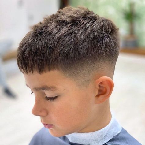 High Taper Fade Haircut with Short Hair on Top with Messy Fringe - Cool Boys Haircuts: Best Hairstyles For Little Boys #boyshair #boyshaircuts #boyshairstyles #littleboys #littleboyshairstyles #cutekids #boyshairstyles #kidshaircuts Jj Haircut, Fade Haircut Boys, Faded Mohawk Boys, Boys Summer Haircut, Teen Boys Haircut Trendy, Boys Fade Haircut Kids, Toddler Fade Haircut, Short Boys Haircut Trendy, Boys Short Haircut